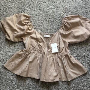Tan peplum top with puff sleeves